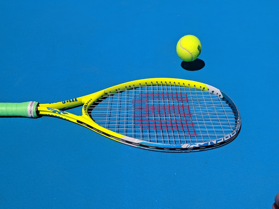 A blue hard court surface with a racquet and ball